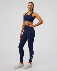 Woman wearing Rep Ultra High-Rise Full Length Legging Pockets - Future Navy-White | Model:Evie | Size:S