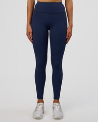 Woman wearing Rep Ultra High-Rise Full Length Legging Pockets - Future Navy-White | Model:Evie | Size:S