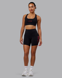 Woman wearing Rep Ultra High-Rise 6" Short Pockets - Black-Scarlet