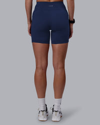 Woman wearing Rep Ultra High-Rise 6" Short Pockets No Logo - Future Navy | Model:Shae | Size:S