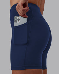Woman wearing Rep Ultra High-Rise 6" Short Pockets No Logo - Future Navy | Model:Shae | Size:S
