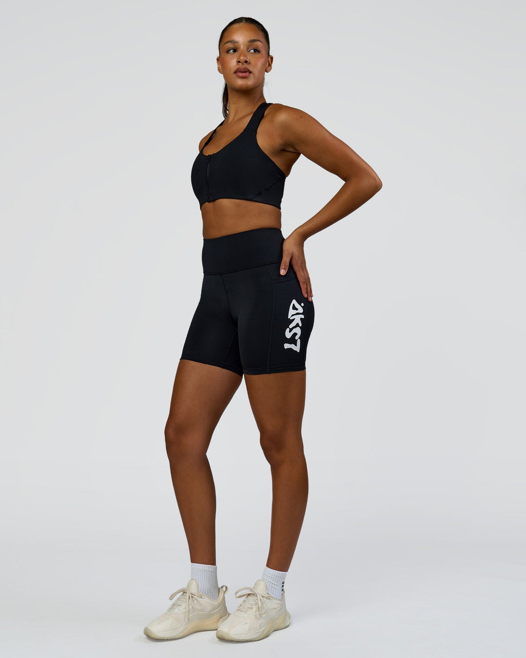 Woman wearing Rep Street Script Ultra High-Rise 6" Short Pockets - Black-White | Model:Rosie | Size:S