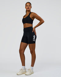 Woman wearing Rep Street Script Ultra High-Rise 6" Short Pockets - Black-White | Model:Rosie | Size:S