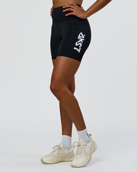 Woman wearing Rep Street Script Ultra High-Rise 6" Short Pockets - Black-White | Model:Rosie | Size:S