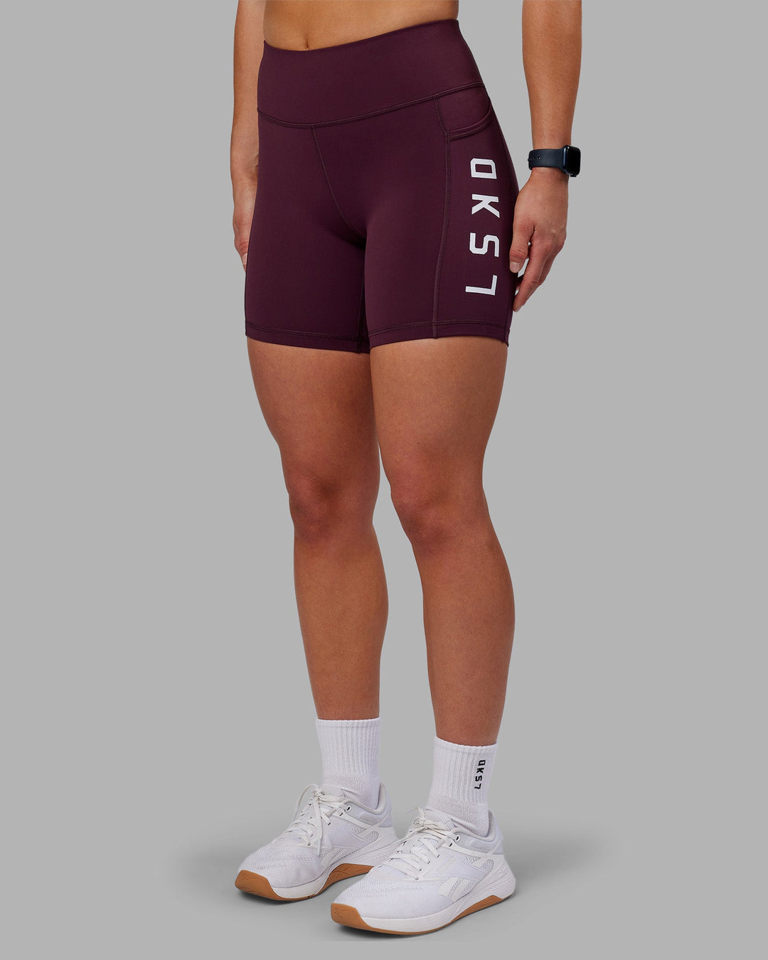 Woman wearing Rep Ultra High-Rise 6" Short Pockets - Cherry Lacquer-White | Model:Keisha | Size:S