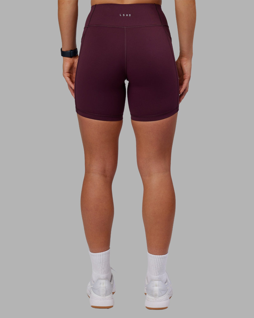 Woman wearing Rep Ultra High-Rise 6" Short Pockets - Cherry Lacquer-White | Model:Keisha | Size:S