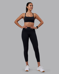 Woman wearing Rep Ultra High-Rise 7/8 Legging Pockets - Black-Black | Model:Rhiley | Size:S