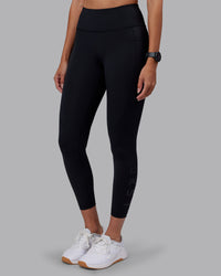 Woman wearing Rep Ultra High-Rise 7/8 Legging Pockets - Black-Black | Model:Rhiley | Size:S