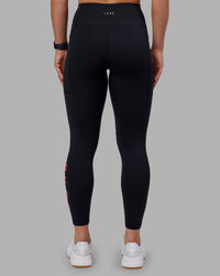 Woman wearing Rep Ultra High-Rise 7/8 Legging Pockets - Black-Scarlet | Model:Keisha | Size:S