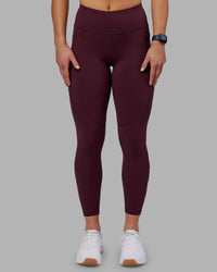 Woman wearing Rep Ultra High-Rise 7/8 Legging Pockets - Cherry Lacquer-White | Model:Keisha | Size:S