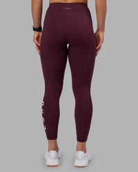 Woman wearing Rep Ultra High-Rise 7/8 Legging Pockets - Cherry Lacquer-White | Model:Keisha | Size:S