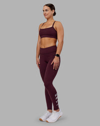 Woman wearing Rep Ultra High-Rise Full Length Legging Pockets - Cherry Lacquer-White | Model:Keisha | Size:S