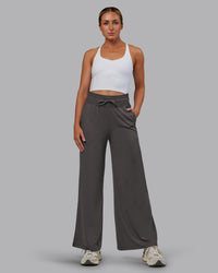 Woman wearing Restore CloudFLX Wide Leg Pant - Dark Storm | Model:Paris | Size:S
