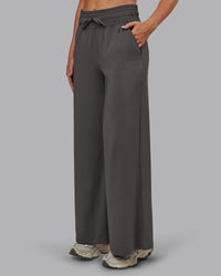 Woman wearing Restore CloudFLX Wide Leg Pant - Dark Storm | Model:Paris | Size:S