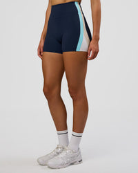 Woman wearing Revitalise Ultra High-Rise 4" Short - Future Navy-Multi | Model:Evie | Size:S