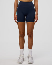 Woman wearing Revitalise Ultra High-Rise 6" Short - Future Navy-Multi | Model:Evie | Size:S