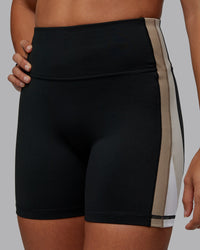 Woman wearing Revitalise Ultra High-Rise 4" Short - Black-Multi | Model:Tylah | Size:S