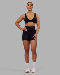 Woman wearing Rhythm Elixir Ultra High-Rise 4" Short - Black | Model:Ayla | Size:S