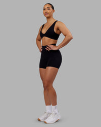 Woman wearing Rhythm Elixir Ultra High-Rise 4" Short - Black | Model:Ayla | Size:S