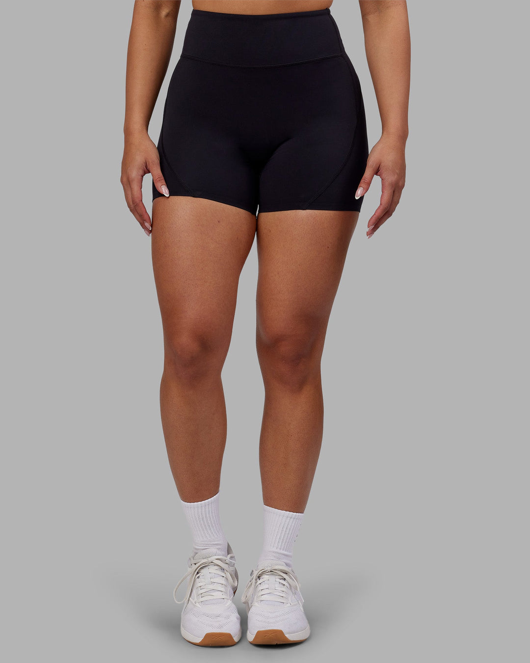 Woman wearing Rhythm Elixir Ultra High-Rise 4" Short - Black | Model:Ayla | Size:S