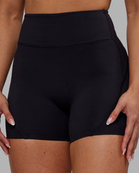 Woman wearing Rhythm Elixir Ultra High-Rise 4" Short - Black | Model:Ayla | Size:S