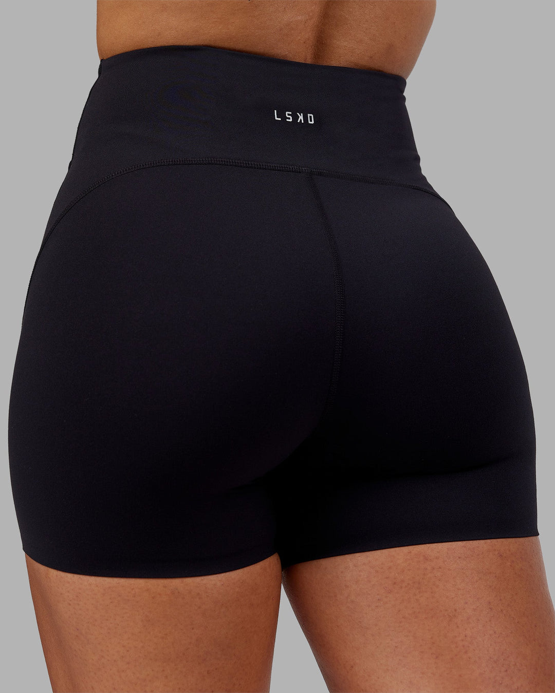 Woman wearing Rhythm Elixir Ultra High-Rise 4" Short - Black | Model:Ayla | Size:S