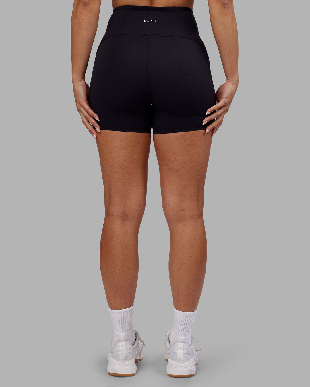 Woman wearing Rhythm Elixir Ultra High-Rise 4" Short - Black | Model:Ayla | Size:S