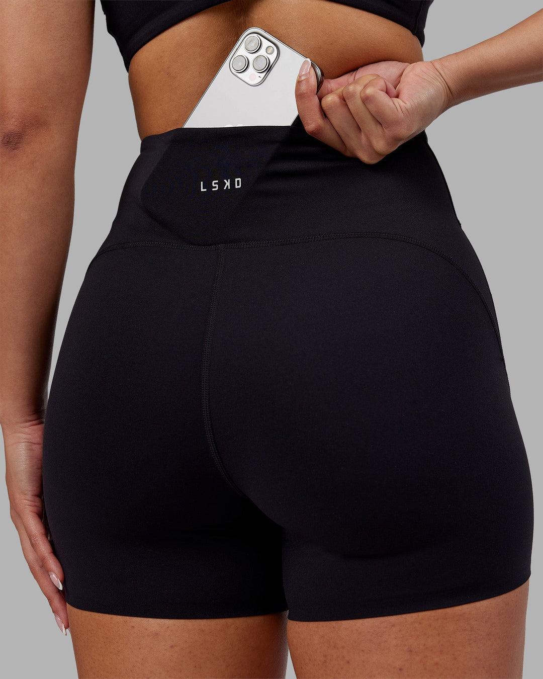 Woman wearing Rhythm Elixir Ultra High-Rise 4" Short - Black | Model:Ayla | Size:S