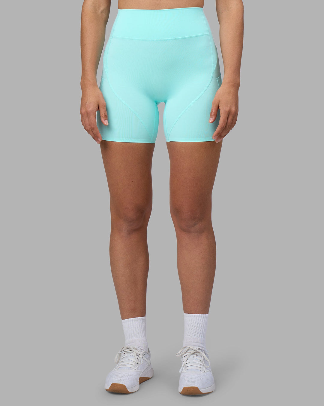 Woman wearing Rhythm Elixir Ultra High-Rise 6" Short Pockets - Island Paradise | Model:Sophie | Size:S