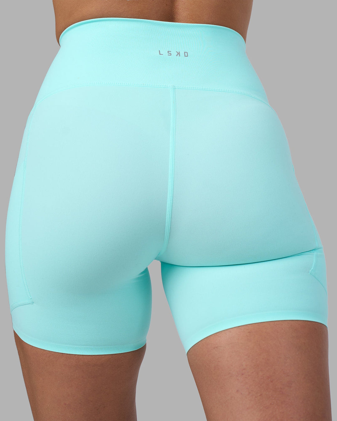 Woman wearing Rhythm Elixir Ultra High-Rise 6" Short Pockets - Island Paradise | Model:Sophie | Size:S