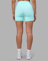 Woman wearing Rhythm Elixir Ultra High-Rise 6" Short Pockets - Island Paradise | Model:Sophie | Size:S
