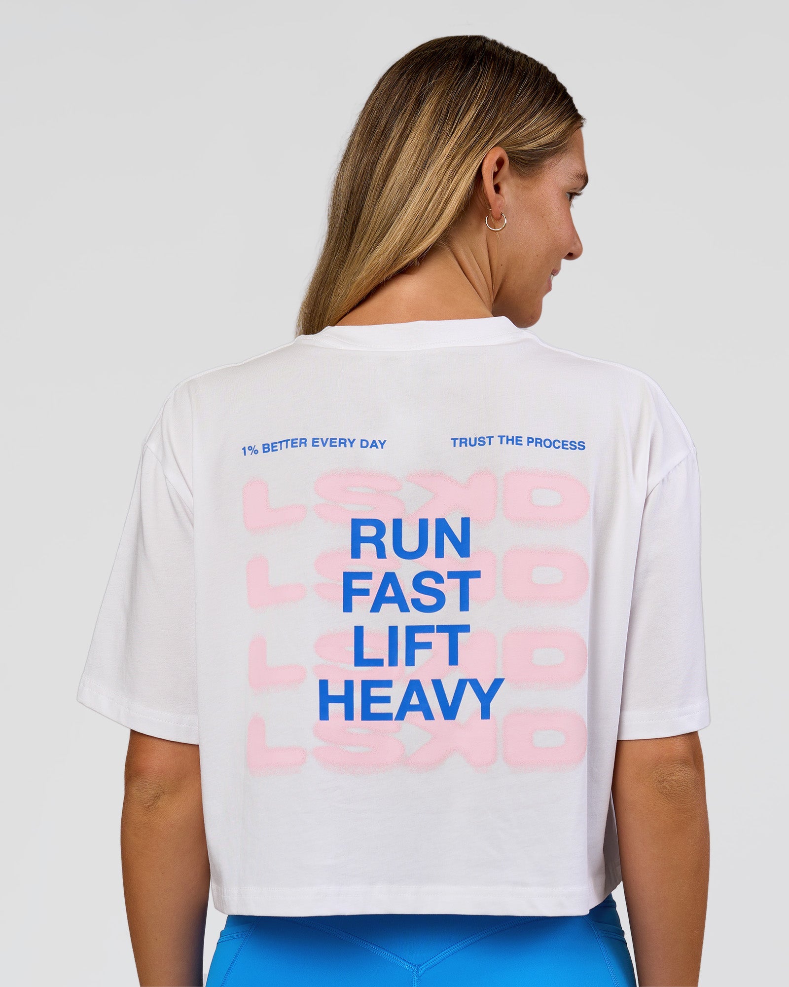 Woman wearing Run Fast Lift Heavy FLXCotton Cropped Tee - White | Model:Amity | Size:S