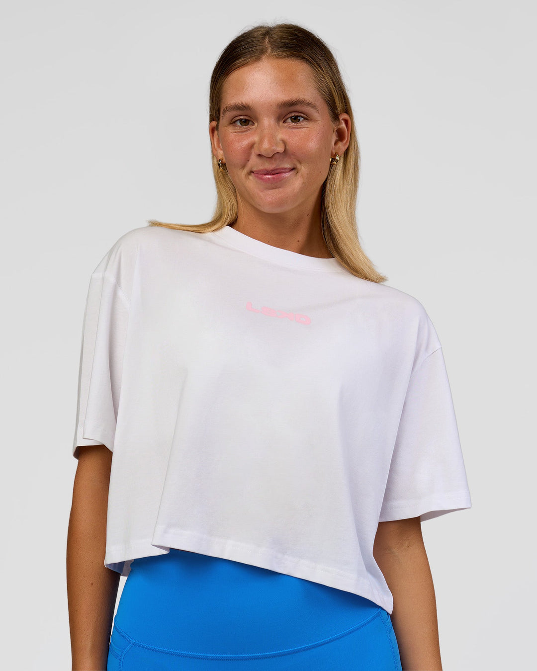 Woman wearing Run Fast Lift Heavy FLXCotton Cropped Tee - White | Model:Amity | Size:S - view 5