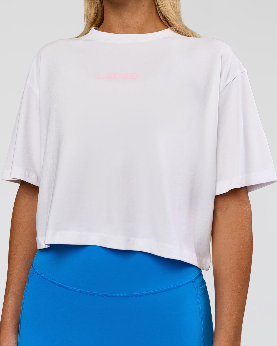 Woman wearing Run Fast Lift Heavy FLXCotton Cropped Tee - White | Model:Amity | Size:S - view 6
