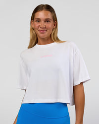 Woman wearing Run Fast Lift Heavy FLXCotton Cropped Tee - White | Model:Amity | Size:S | Thumbnail Index: 1