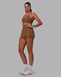 Woman wearing Rush Sports Bra -Caramel-Agile Print | Model:Phoebe | Size:S