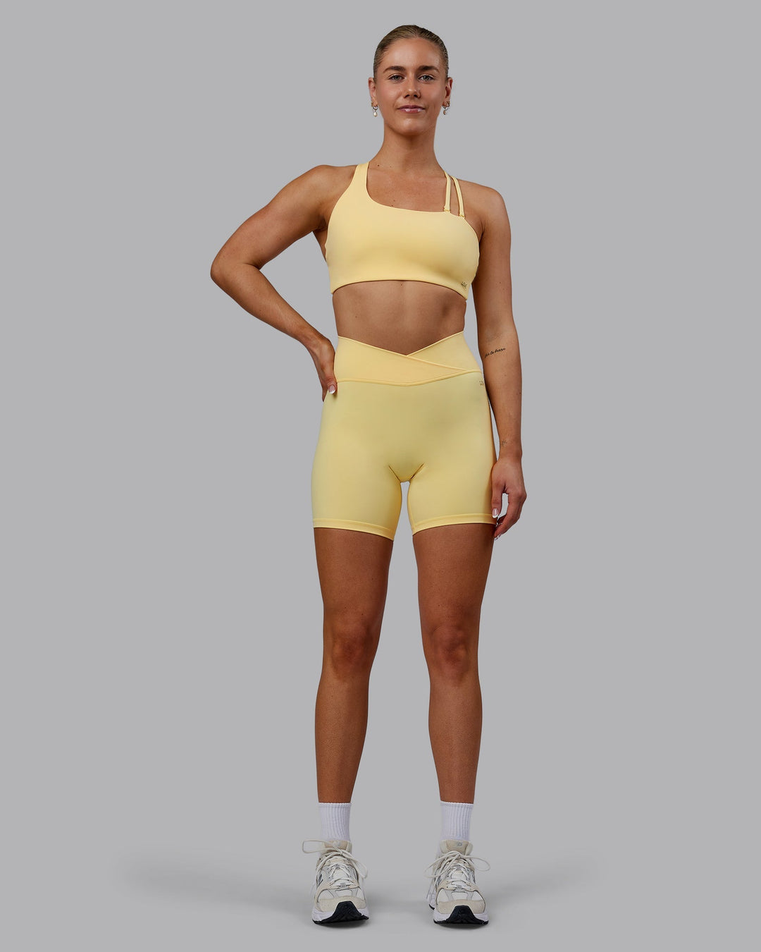 Woman wearing Sara Helios Sports Bra - Sunflower