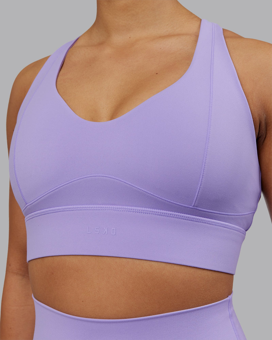 Woman wearing Sculpt Sports Bra - Violet Ray | Model:Ayla | Size:S