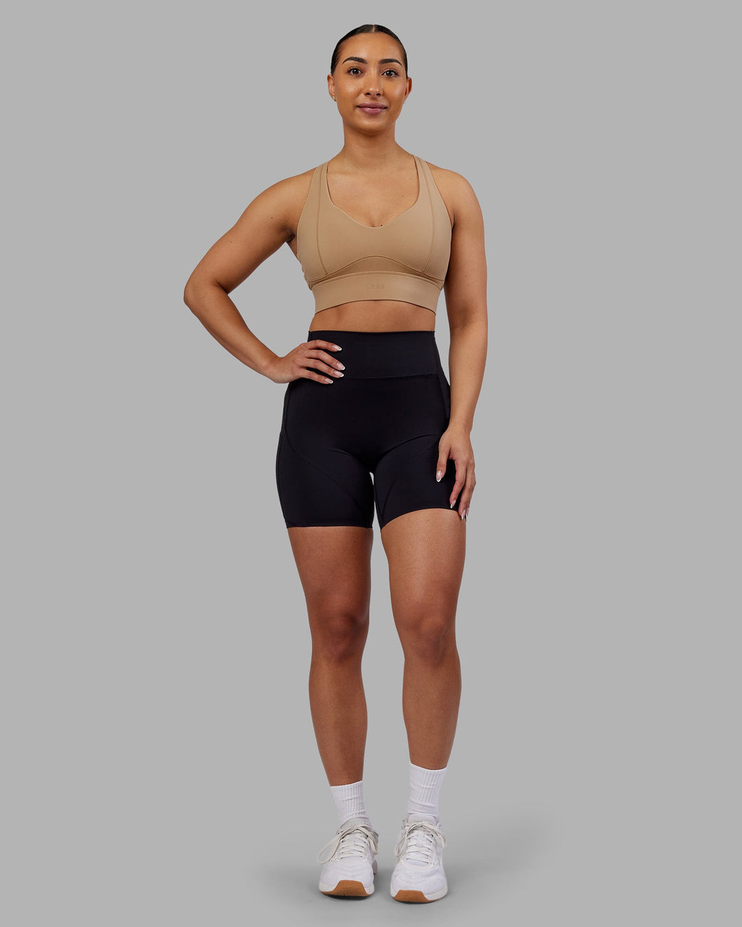 Woman wearing Sculpt Sports Bra - Warm Smoke| Model:Ayla | Size:S