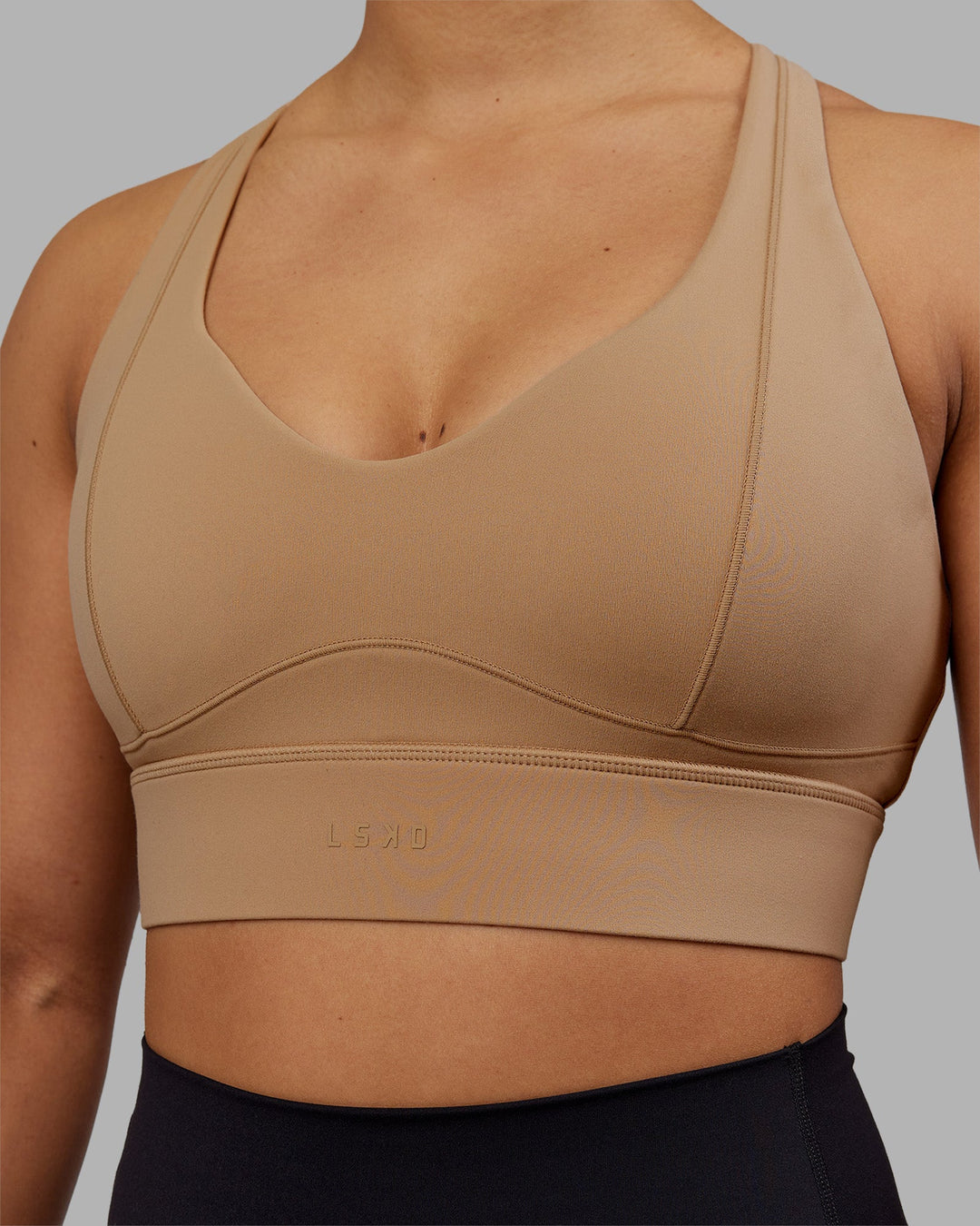 Woman wearing Sculpt Sports Bra - Warm Smoke| Model:Ayla | Size:S