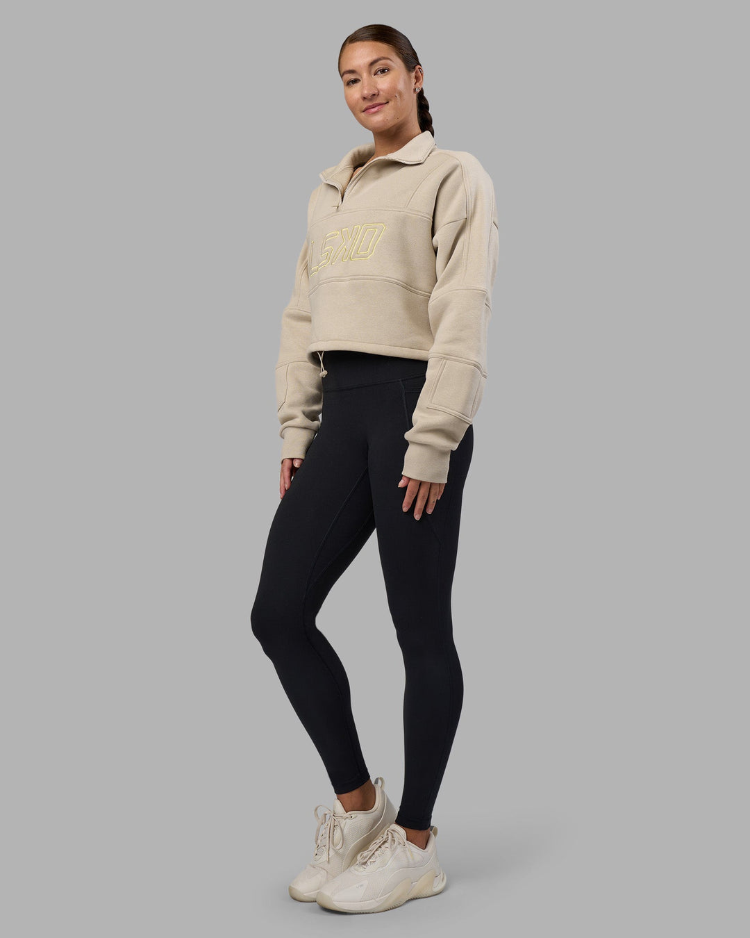 Woman wearing Slam Quarter Zip Sweater - Shale Beige-Lime Glo | Model:Hannah | Size:S