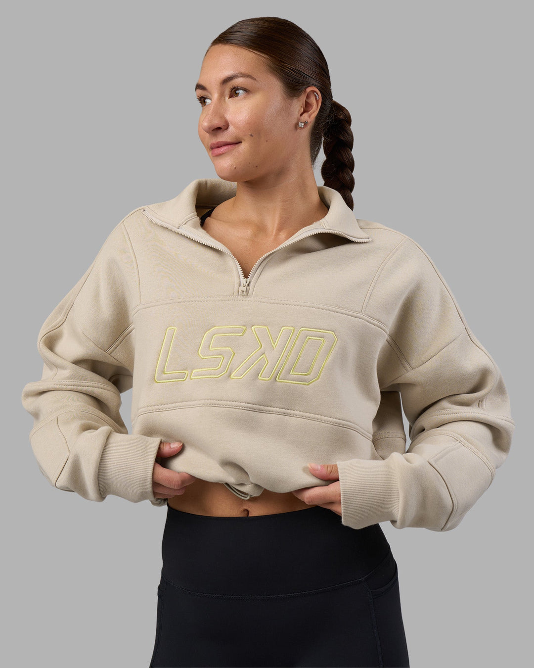 Woman wearing Slam Quarter Zip Sweater - Shale Beige-Lime Glo | Model:Hannah | Size:S