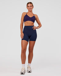 Woman wearing Spark Seamless Ribbed Sports Bra - Future Navy-Ultra Fuchsia | Model:Amity | Size:S