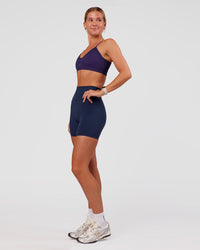Woman wearing Spark Seamless Ribbed Sports Bra - Future Navy-Ultra Fuchsia | Model:Amity | Size:S