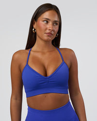 Woman wearing Spark Seamless Sports Bra - Power Cobalt | Model:Bianca | Size:S