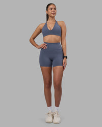 Woman wearing Stamina Pulse Sports Bra - Night Shadow | Model:Rhiley | Size:S