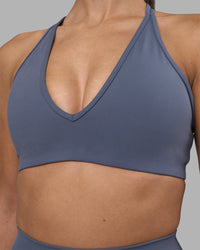 Woman wearing Stamina Pulse Sports Bra - Night Shadow | Model:Rhiley | Size:S