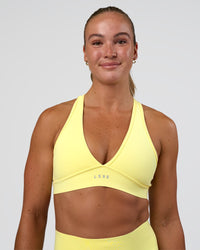 Woman wearing Stamina Rise Sports Bra - Yellow Fizz | Model:Sav | Size:S