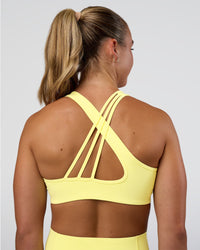 Woman wearing Stamina Rise Sports Bra - Yellow Fizz | Model:Sav | Size:S