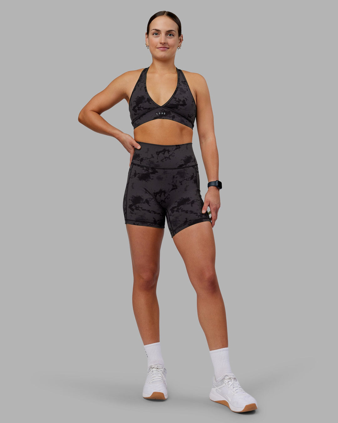 Woman wearing Stamina Sports Bra - Black Tie Dye | Model:Keisha | Size:S